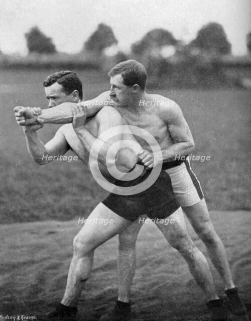 The flying mare outside, wrestling display, Aldershot, Hampshire, 1896. Artist: Gregory & Co