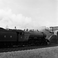 The Flying Scotsman passing under a bridge at speed, near Selby, North Yorkshire, 1968. Artist: Michael Walters