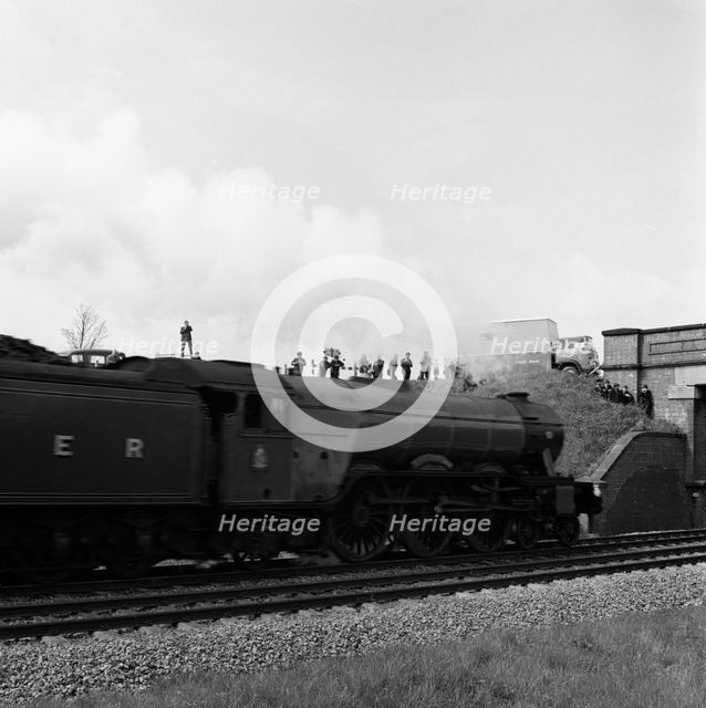 The 'Flying Scotsman' passing under a bridge at speed, near Selby, North Yorkshire, 1968. Artist: Michael Walters