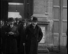 The French Prime Minister Aristide Briand Standing Outside with a Group of Male Civilians..., 1926. Creator: British Pathe Ltd