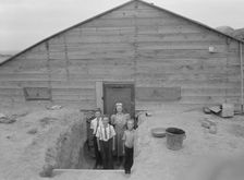 The Free children in doorway of their home in Sunday clothes, Dead Ox Flat, Oregon, 1939. Creator: Dorothea Lange
