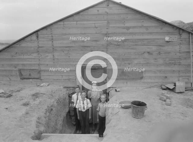 The Free children in doorway of their home in Sunday clothes, Dead Ox Flat, Oregon, 1939. Creator: Dorothea Lange.