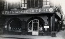 The front door of the Pharmacie du Cerf on the corner of the street, Strasbourg, c1900s.. Creator: Unknown