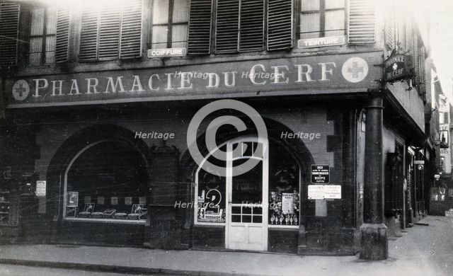 The front door of the Pharmacie du Cerf on the corner of the street, Strasbourg, c1900s.. Creator: Unknown.