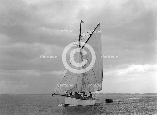 The gaff rig sailboat 'Bunty' close-hauled, 1921. Creator: Kirk & Sons of Cowes.