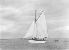 The gaff rig sailboat Bunty close-hauled, 1921. Creator: Kirk & Sons of Cowes