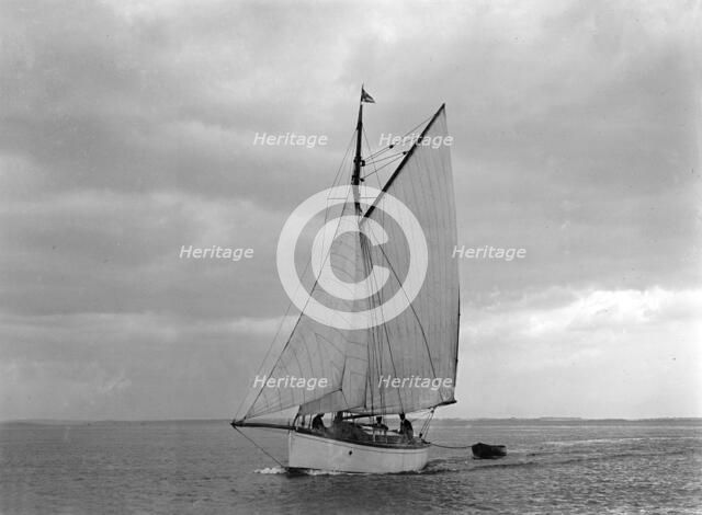 The gaff rig sailboat 'Bunty' close-hauled, 1921. Creator: Kirk & Sons of Cowes.