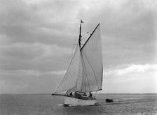 The gaff rig sailboat Bunty close-hauled, 1921. Creator: Kirk & Sons of Cowes