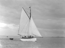 The gaff rig sailboat Bunty close-hauled, 1921. Creator: Kirk & Sons of Cowes