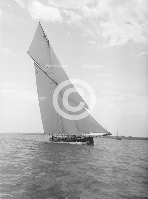 The gaff rigged cutter 'Bloodhound' sailing close-hauled, 1911. Creator: Kirk & Sons of Cowes.
