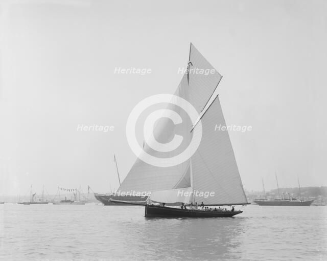 The gaff rigged cutter 'Bloodhound' sailing in light winds, 1908. Creator: Kirk & Sons of Cowes.