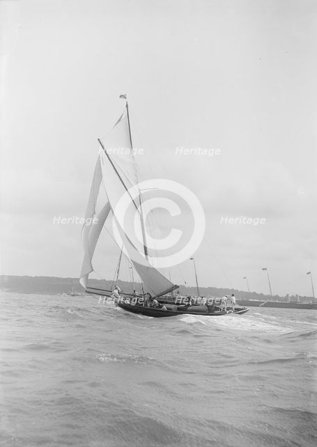 The gaff rigged cutter 'Bloodhound' sailing on a broad reach, August 1912. Creator: Kirk & Sons of Cowes.