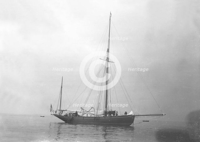 The gaff yawl 'Coral' at anchor, 1922. Creator: Kirk & Sons of Cowes.
