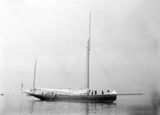 The gaff yawl Coral at anchor, 1922. Creator: Kirk & Sons of Cowes