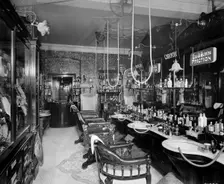 The gentlemen's hairdressing saloon in the Hotel Cecil in The Strand, London, 1911. Artist: Bedford Lemere and Company