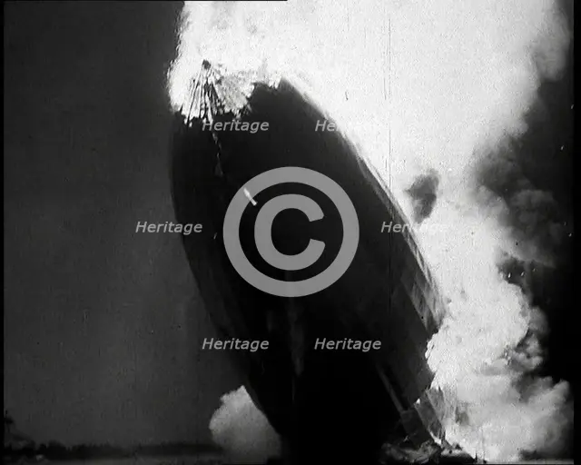 The German Airship, the Hindenburg, its Rear Half Destroyed And Obscured By Smoke With..., 1937. Creator: British Pathe Ltd.