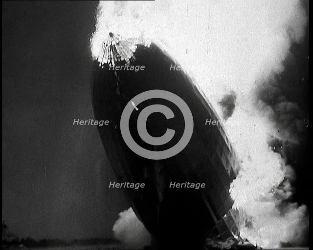 The German Airship, the Hindenburg, its Rear Half Destroyed And Obscured By Smoke With..., 1937. Creator: British Pathe Ltd.