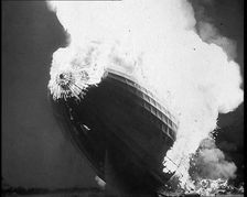 The German Airship, the Hindenburg, its Rear Half Destroyed And Obscured By Smoke With..., 1937. Creator: British Pathe Ltd