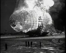 The German Airship, the Hindenburg, its Rear Half Destroyed And Obscured By Smoke With..., 1937. Creator: British Pathe Ltd