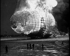 The German Airship, the Hindenburg, its Rear Half Destroyed And Obscured By Smoke With..., 1937. Creator: British Pathe Ltd