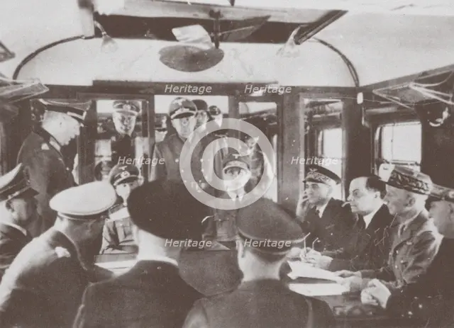 The German and French delegations inside a railroad car at Compiègne for the signing of France's sur Artist: Anonymous  