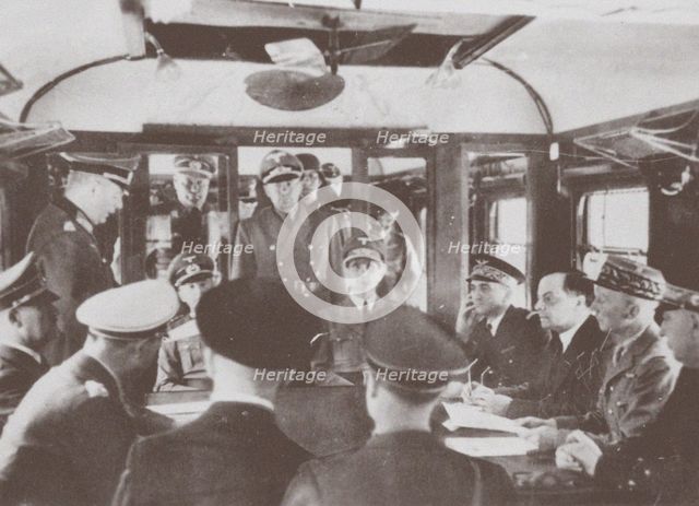 The German and French delegations inside a railroad car at Compiègne for the signing of France's sur Artist: Anonymous  