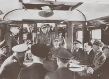 The German and French delegations inside a railroad car at Compiègne for the signing of France's sur Artist: Anonymous