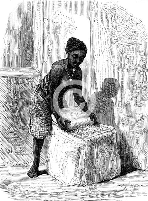 The Gold Coast and Ashantee War: woman grinding corn at Accra, 1873. Creator: Unknown.