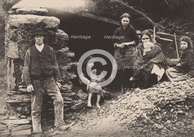 The Great Famine. A family at the ruins of their house in Killarney, 1888.
