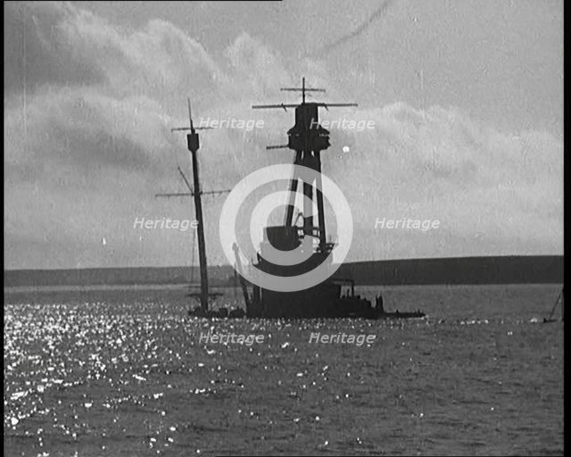 The Hulls of German Warships Scuttled in Scapa Flow Rising from the Waves, 1929. Creator: British Pathe Ltd.