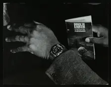 The hands and book of American double bassist Eddie Jones, Welwyn Garden City, Hertfordshire, 1967. Creator: Denis Williams
