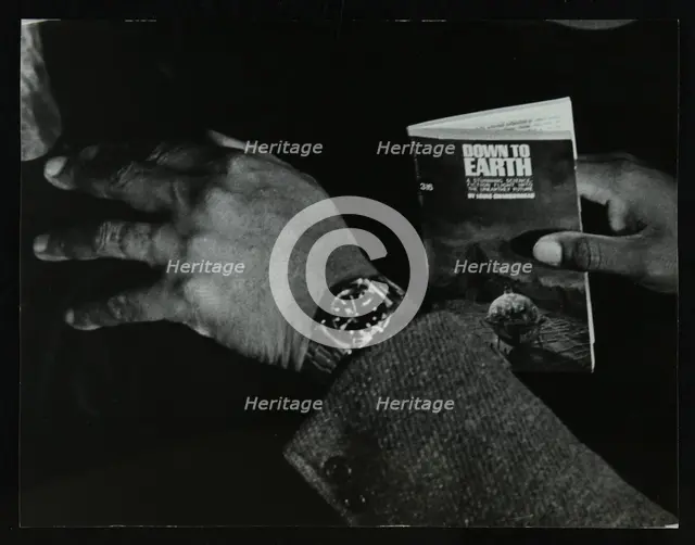 The hands and book of American double bassist Eddie Jones, Welwyn Garden City, Hertfordshire, 1967. Creator: Denis Williams.