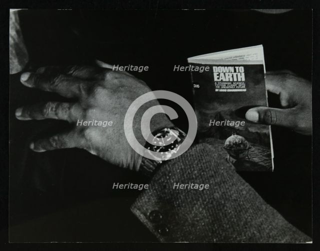 The hands and book of American double bassist Eddie Jones, Welwyn Garden City, Hertfordshire, 1967. Artist: Denis Williams