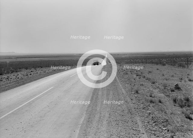 The highway going West, U.S. 80 near Lordsburg, New Mexico, 1938. Creator: Dorothea Lange.