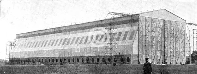 The Home Of "Zeppelin I": The Newly Built Air-Ship Shed..., Near Metz, 1909.  Creator: Reclam.