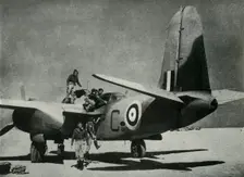The hot sun streams down on a desert landing ground c1942-1943, (1945). Creator: Unknown