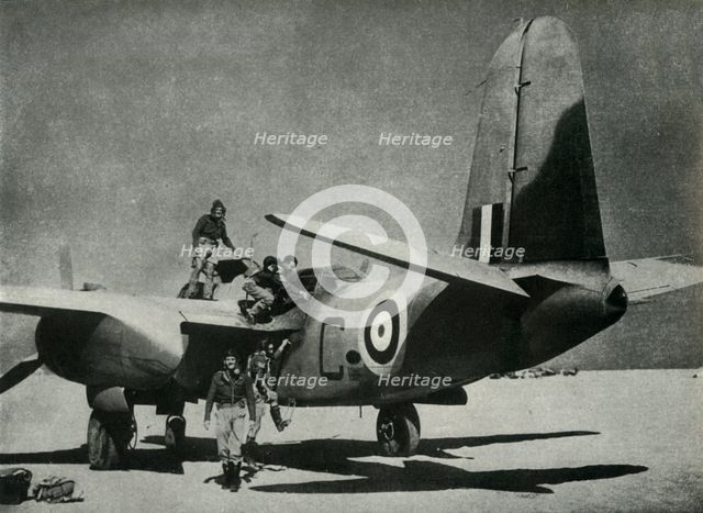 'The hot sun streams down on a desert landing ground', c1942-1943, (1945). Creator: Unknown.