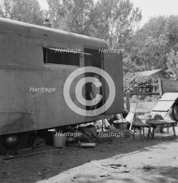 The house trailer and the youngest little girl, Washington, Yakima Valley, Toppenish, 1939. Creator: Dorothea Lange.