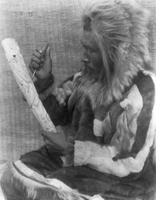 The ivory carver-Nunivak, c1929. Creator: Edward Sheriff Curtis