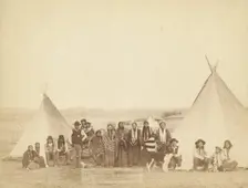 The Indian Girl's Home A group of Indian girls and Indian police at Big Foot's village..., 1890. Creator: John C. H. Grabill