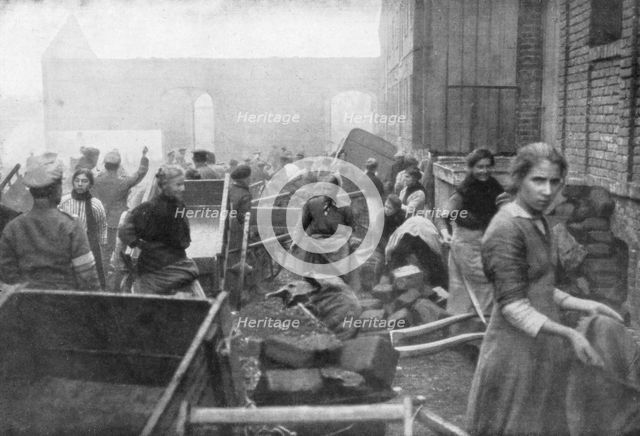 The inhabitants of Caudry come to seek food from the British Army, France, 1918. Artist: Unknown
