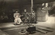 The interior of a Buryat yurt. In the center is a householder with two wives, 1905. Creator: L Veniukov