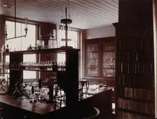 The interior of a pharmaceutical or chemical laboratory with a bench..., c1890s. Creator: Unknown