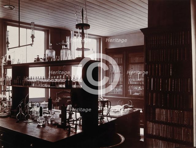 The interior of a pharmaceutical or chemical laboratory with a bench..., c1890s. Creator: Unknown.