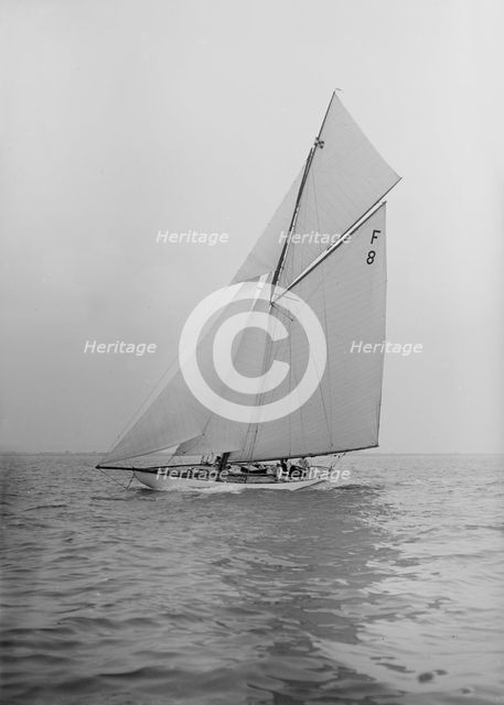 The International 10 Metre class 'Pampero' (F8) sailing close-hauled, 1913. Creator: Kirk & Sons of Cowes.