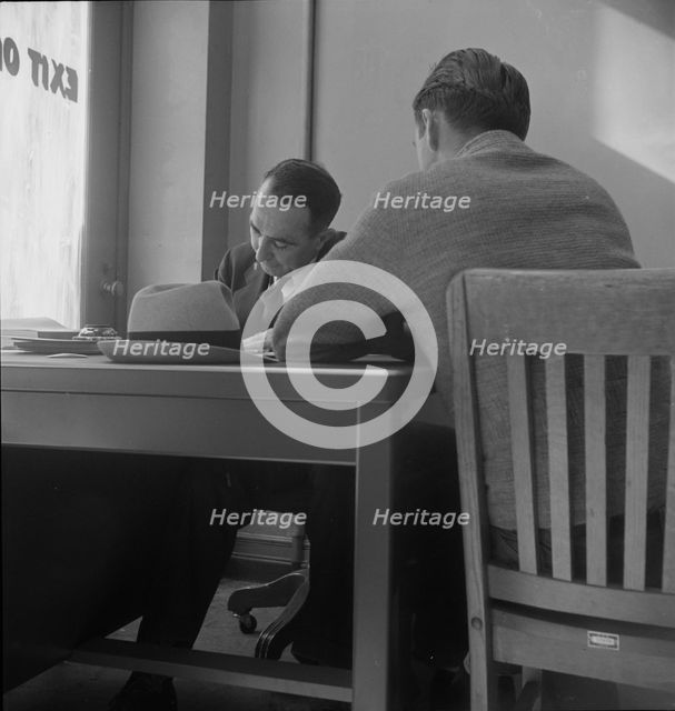 The interview for unemployment compensation, San Francisco, California, 1938. Creator: Dorothea Lange.
