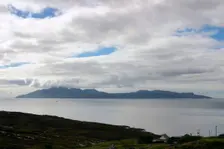 The island of Rum from Skye, Highland, Scotland. Creator: Peter Thompson