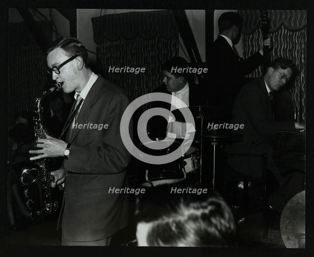 The John Cox Trio and Derek Humble playing at the Civic Restaurant, Bristol, 1955.  Creator: Denis Williams.