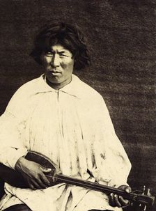 The Kachins Young Foreigner with a Musical Instrument Called a "Komuz", 1894. Creator: Unknown