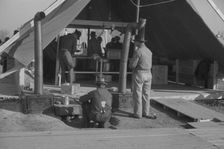The kitchen in the camp for white flood refugees at Forrest City, Arkansas, 1937. Creator: Walker Evans